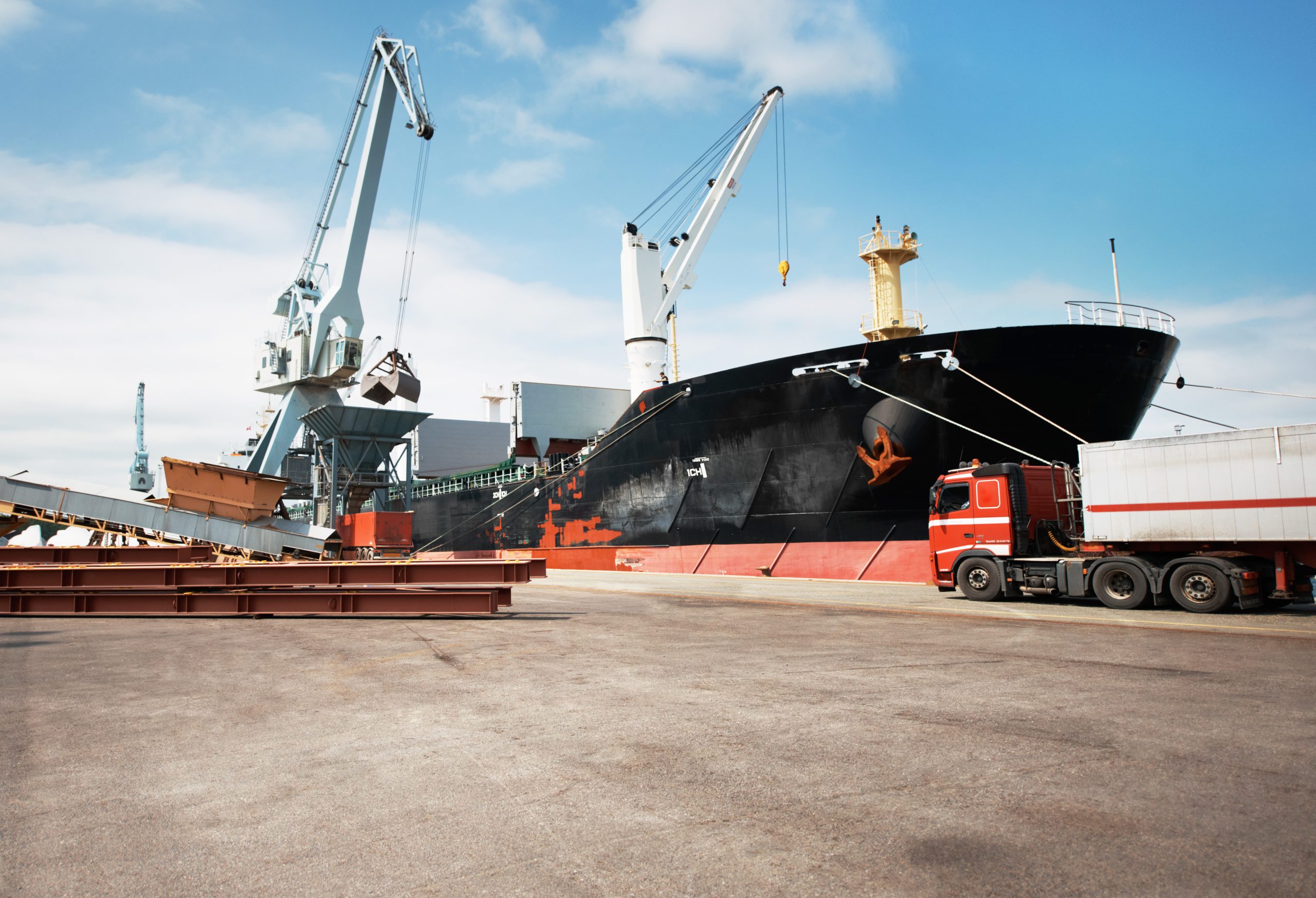 a-photo-of-a-harbor-with-anchored-ships-and-a-stat-2022-12-10-01-47-26-utc